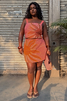 Pink Sol Beaded Wrap Skirt with a hand-embroidered sun motif and gold sequins on a size L model.
