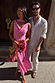 Pink Sophie Dress with shimmering gold flecks and a cowl neck, paired with a multi-wear scarf for a wedding guest look.