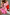 Thumbnail for Pink paisley Splice Bandana Cardigan with leopard print details and a red sleeve on a seated model.