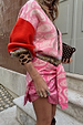 Pink paisley Splice Bandana Cardigan with leopard print trims and red sleeves, styled tied around the waist.