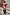 Thumbnail for Pink paisley and leopard print Splice Bandana Cardigan with red accents, styled on a model on stone steps.