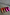 Thumbnail for Pink and red leather trainers beside leopard print sneakers with orange laces on a grey concrete background.