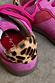 Pink and Red Leather Trainer detail featuring a leopard print heel tab and soft pink suede upper.