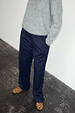 Navy Pinstripe Arden Trousers in a sleek pinstripe print, styled with a grey knit jumper and leopard print shoes.