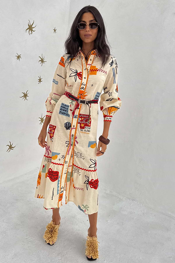 Cream Poema Shirt Dress featuring colourful motifs, orange lettuce trim and a tiered ruffle hem.