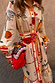 Poema Shirt Dress featuring colourful poem motifs, a tie belt and orange lettuce trim on a cream cotton-linen base.