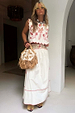 Cream cotton Pollenca Skirt featuring red palm motifs and blanket stitching, part of a vacation co-ord.