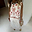 Cream and Red Pollenca Top featuring red palm tree embroidery and a scalloped hem with contrast stitching.