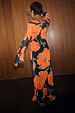 Black Poppy Aria Mesh Dress in sheer black mesh with a vibrant orange poppy print and flared sleeves.