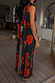 Black Poppy Sophie Dress featuring a poppy and polka dot print with a draped back and long detachable scarf.