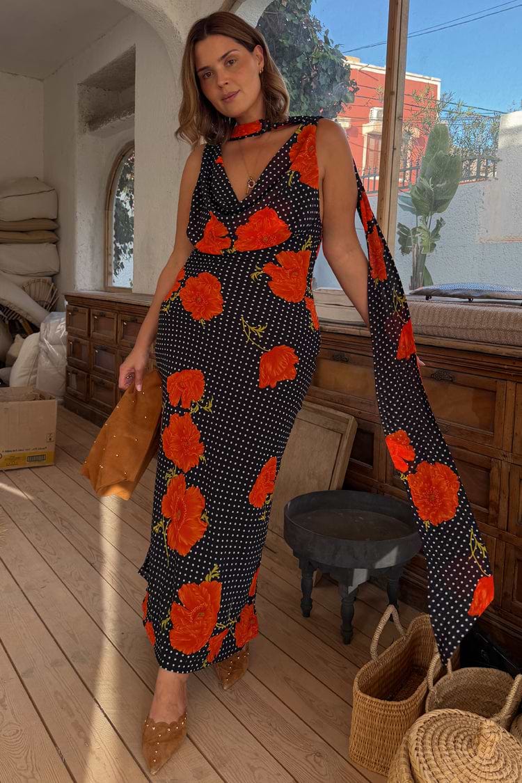 Black Poppy Sophie Dress in a poppy and polka dot print, with a draped cowl neckline and detachable scarf detail.