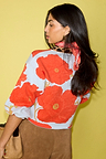 Blue Poppy Cardigan featuring red poppies and an iconic leopard print collar in a soft touch knit.
