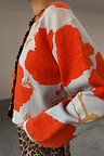 Blue Poppy Cardigan in pale blue knit with an orange poppy print and leopard print trim.