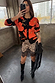 Thumbnail for Black Poppy Cardigan with a red floral print, styled with a leopard print lace skirt and black fringed bag.