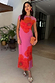 Pink Poppy Sleeveless Mesh Dress featuring an iconic poppy print on a pink mesh base, worn by a model.