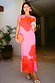 Thumbnail for Pink Poppy Sleeveless Mesh Dress with a red poppy print, styled with an orange clutch for an occasion.