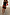 Thumbnail for Black Poppy Mini Maeva Skirt with red poppy and polka dot print and a black lace trim at the hem.