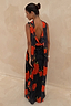 Black Poppy Sophie Dress with red poppies and white polka dots, featuring a statement draped back and scarf detail.