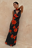 Black Poppy Sophie Dress with a red poppy and polka dot print, featuring a cowl neck and matching scarf.