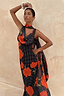 Black Poppy Sophie Dress Petite with red poppy and polka dot print, featuring a multi-wear scarf for a vacation look.