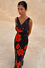 Thumbnail for Black Poppy Sophie Dress with red floral and polka dot print, featuring a draped scarf neckline and sleeveless design.