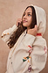 Thumbnail for Cream Sundazed Accessible Hoodie with colourful abstract prints, featuring a zip front and drawstring hood.