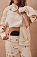 Thumbnail for Cream Sundazed Accessible Hoodie with unique symbols, featuring concealed zips for easy medical treatment access.