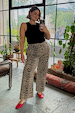 Black Ribbed Tank in soft stretch fabric, styled with leopard print trousers and red heels for a London look.