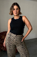 Black ribbed tank top and leopard print trousers, styled on model Pilar as an iconic London look.
