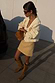 Thumbnail for Cream Raffia Wrap Skirt styled with an embroidered jacket and brown suede boots for a textured London look.