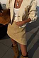Thumbnail for Cream textured Raffia Wrap Skirt paired with a matching embroidered jacket and slouchy brown boots.