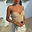 Beige Raffia Cecilia Top with multi-wear beaded straps and a textured corset bodice for a vacation look.