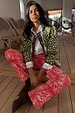 Straight leg Red Bandana Jeans in a red and white paisley print, styled with a green quilted jacket and white shirt.