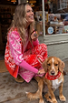 Red Bandana Martha Cardigan in pink and red knit, styled with matching joggers and a dog.