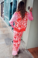 Red Bandana Martha Cardigan and matching joggers in a red and pink bandana print for a London look.