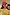 Thumbnail for Red Bandana Cap featuring a pink embroidered NFD logo, styled with a yellow ribbed sweater on a model.