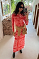 Red Bandana Rib Dorris Skirt and matching Alexa cardigan co-ord styled with a tan sweater in a mirror selfie.
