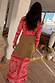 Red Bandana Rib Dorris Skirt co-ord in an iconic print, styled with a tan wrap layer and shown from the back.