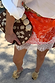 Iconic Red Bandana Maeva Skirt with a white lace trim, styled with a beaded bag and raffia sandals.