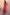Thumbnail for Red Bandana Remi Dress featuring a ruffled neck and leopard print sleeves, styled with a patterned clutch.