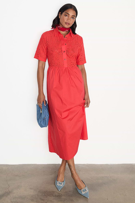 Red Palm Broderie Hayley Dress in cotton with a button-up front and short sleeves, styled with blue heels.