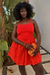 Red Broderie Mini Lola Dress in cotton with thin straps and palm-patterned broderie details.