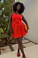 Thumbnail for Red Broderie Mini Lola Dress with a palm-patterned skirt and thin straps, highlighting inclusive sizing.
