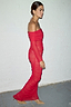 Red Diaz Dress in ruched mesh with an off-the-shoulder neckline and long sleeves, shown from the side.