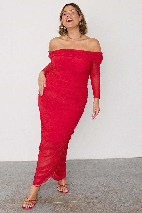 Red Diaz Dress in ruched mesh with long sleeves and an off-the-shoulder neckline, worn by a size 18 model.