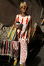 Cream Marina Marra Trousers in a red fish print cotton, styled with a matching waistcoat for vacation.