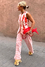 Thumbnail for Cream Marina Marra Trousers in lightweight cotton with a red fish print, styled for a vacation-ready London look.
