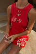 Red Snake Love Rib Tank with white snake motifs on ribbed fabric, styled with gold jewellery and printed shorts.