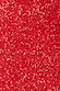 Red shimmering sequins on the Mini Jaspre Skirt, capturing the light-reflecting texture and sparkle.
