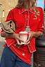 Thumbnail for Red Mystical Cardigan with jacquard motifs and blanket stitch detailing, styled with a tan clutch and jeans.